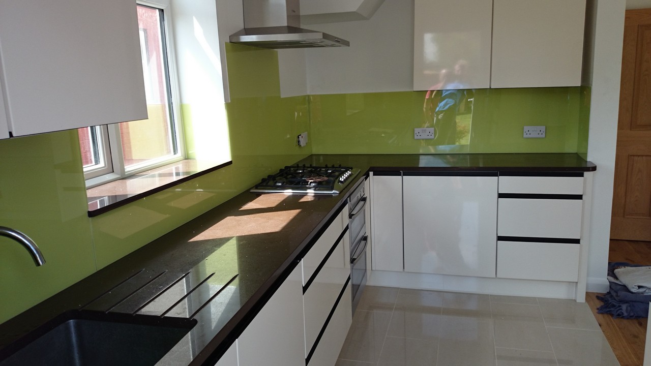 Lime green glass kitchen splashback installed by  Bromley by Bow glaziers