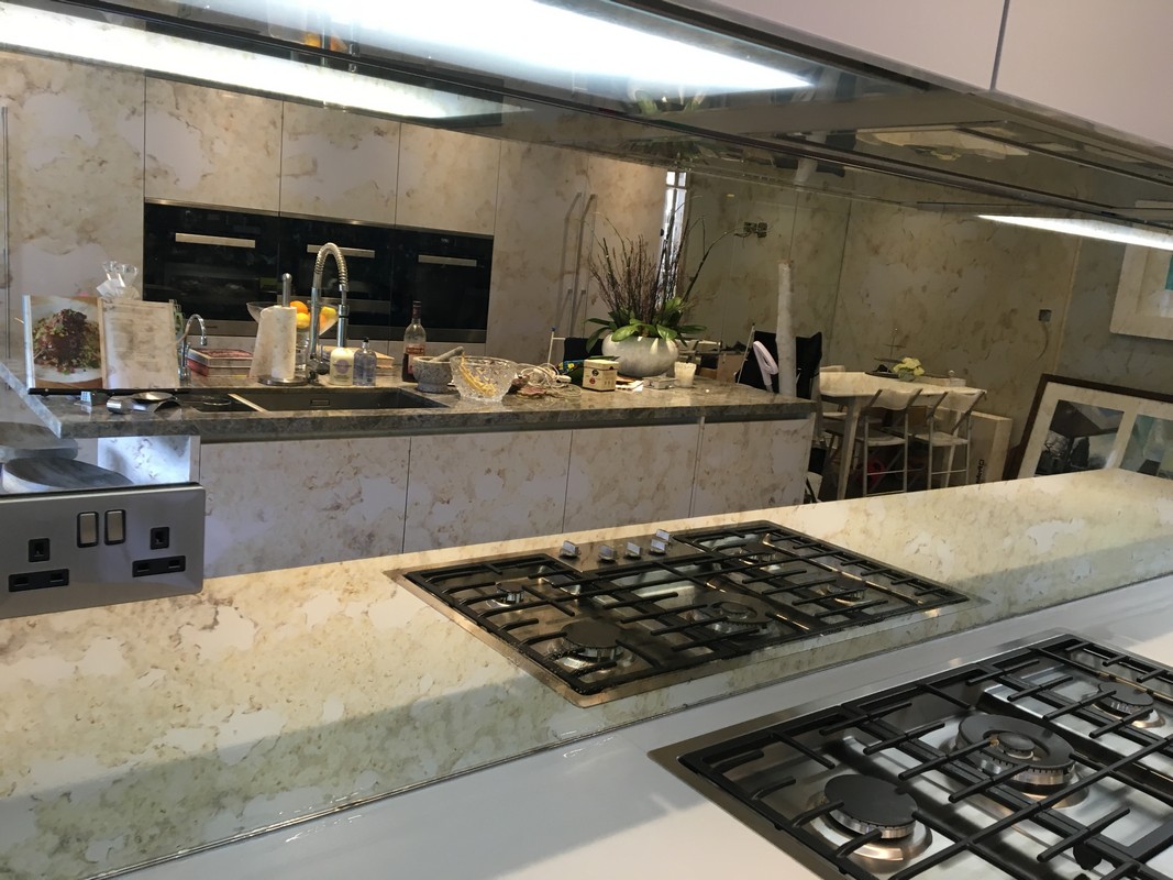 Mirror glass splashback in  Bromley by Bow luxury kitchen