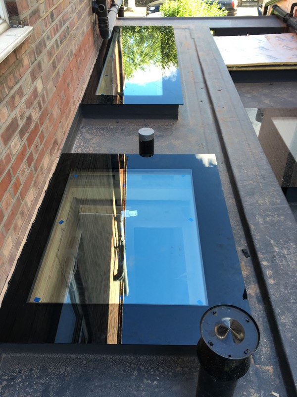 Multiple flat roof skylights on extension in  Bromley by Bow