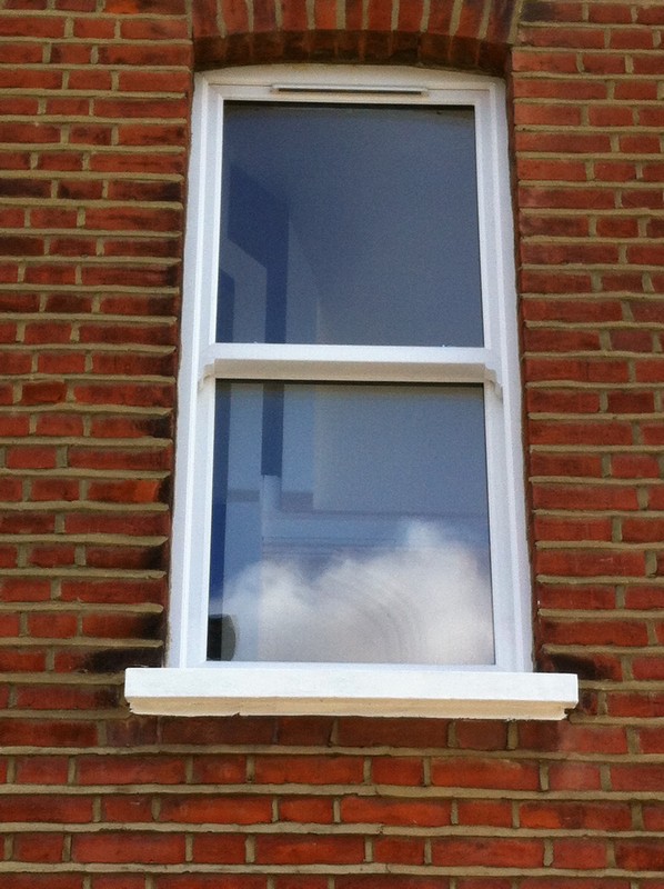uPVC sash window on Victorian red brick house in  Bromley by Bow